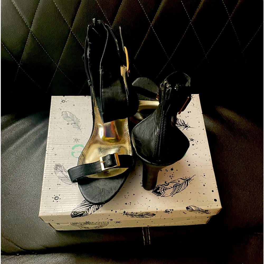 Black wedge heel with 4 1/2 inch heel.